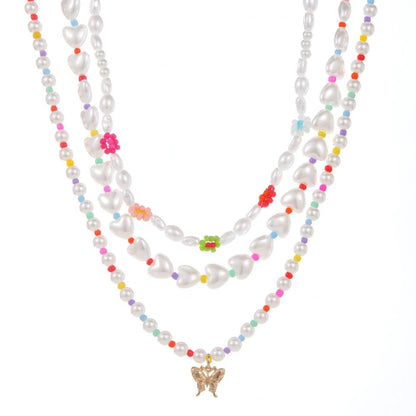 Elegant gold-plated necklace set featuring multi-row imitation pearl design, perfect for formal and casual wear