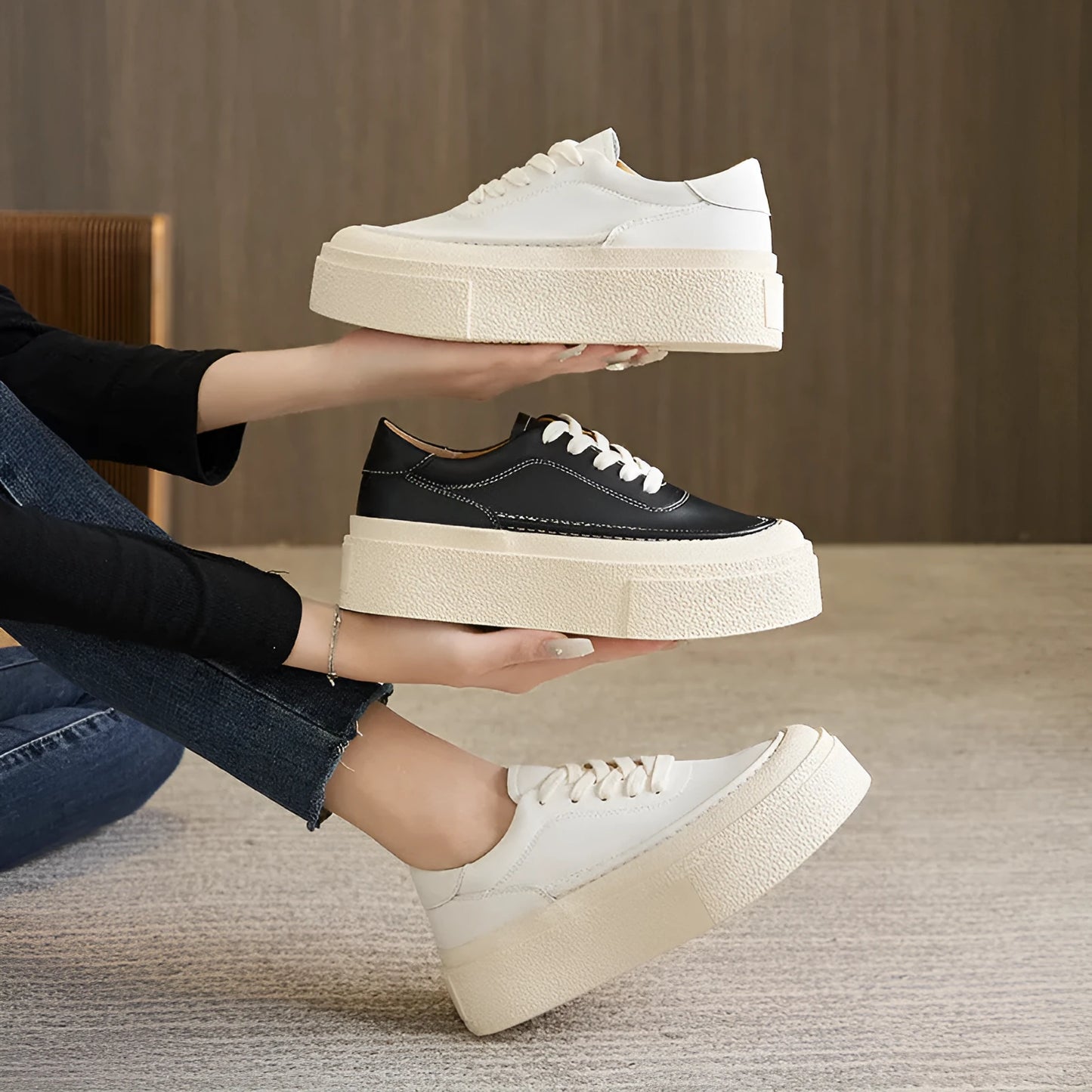 Women's black platform casual shoes with round toe and tied laces on a rubber sole.