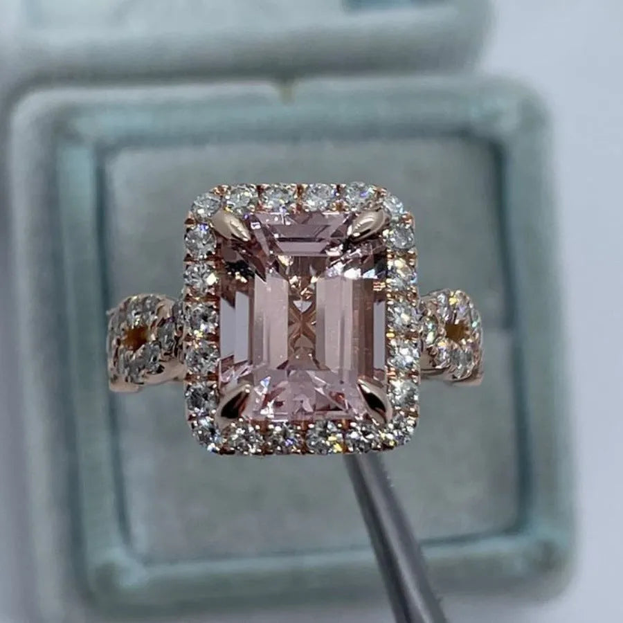 Rose gold geometric alloy ring showing electroplated finish and structured shape.