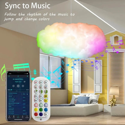 White fabric cloud shaped light hanging from ceiling with multi-coloured LED glow.