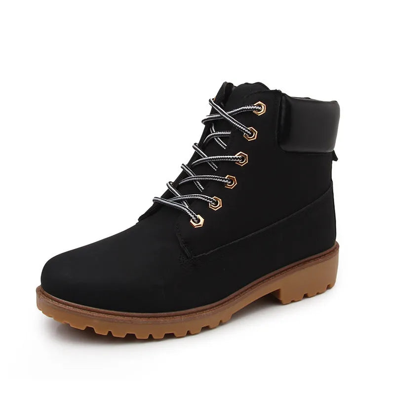 Martin boots with lace-up front, round toe and flat low heel in pink with velvet lining
