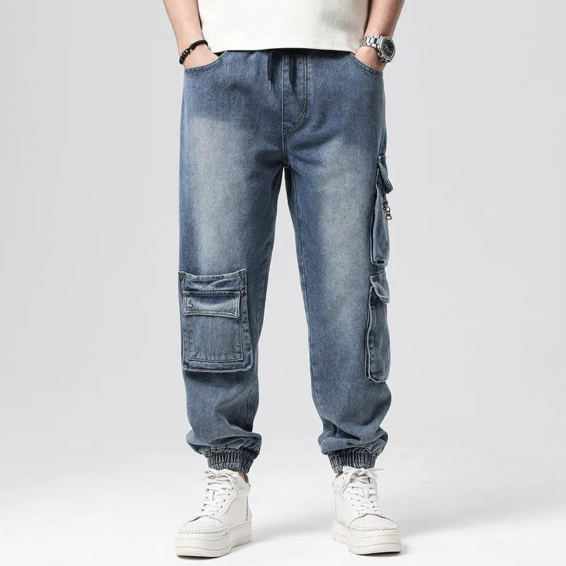 Men's high-waisted loose denim trousers with multiple pockets showing straight leg opening