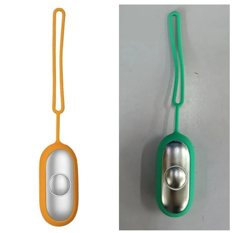Hand-held micro-current sleep aid device in grey, green, or orange with round button and USB charging port