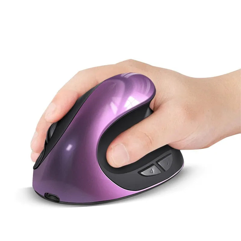 Ergonomic vertical mouse in black, shown next to a laptop, highlighting its unique upright shape and USB receiver.