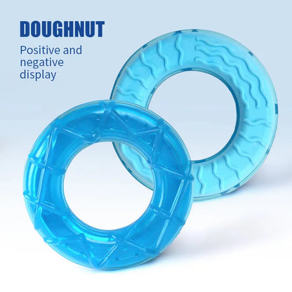 Set of four water-filled silicone dog cooling toys: pacifier, popsicle, and two rings.