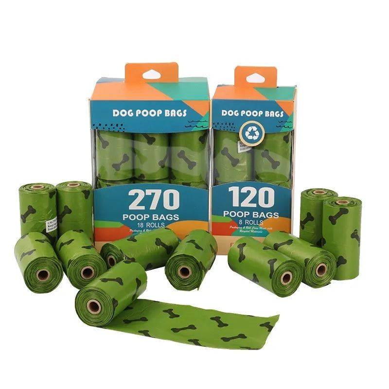Roll of military green degradable dog poop bags with black bone print, shown next to a plastic dispenser.