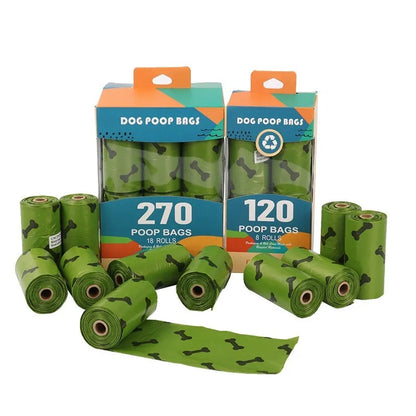 Roll of military green degradable dog poop bags with black bone print, shown next to a plastic dispenser.
