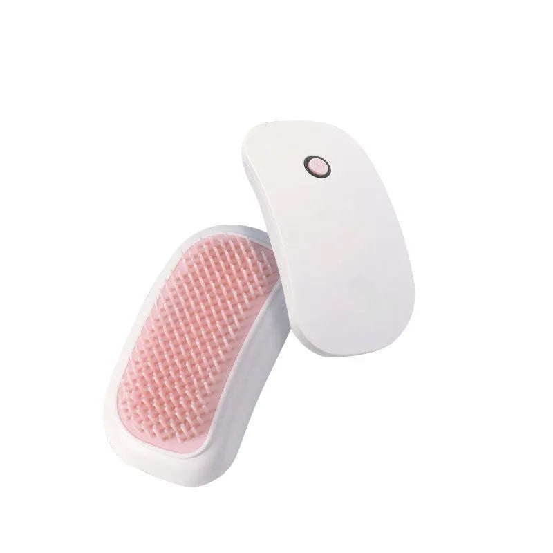Fuigarry pink handheld electric pet grooming brush with soft TPE teeth on a white background