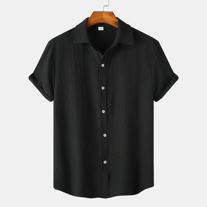 Men's casual short-sleeved cardigan shirt in polyester fabric showing colour options and relaxed fit