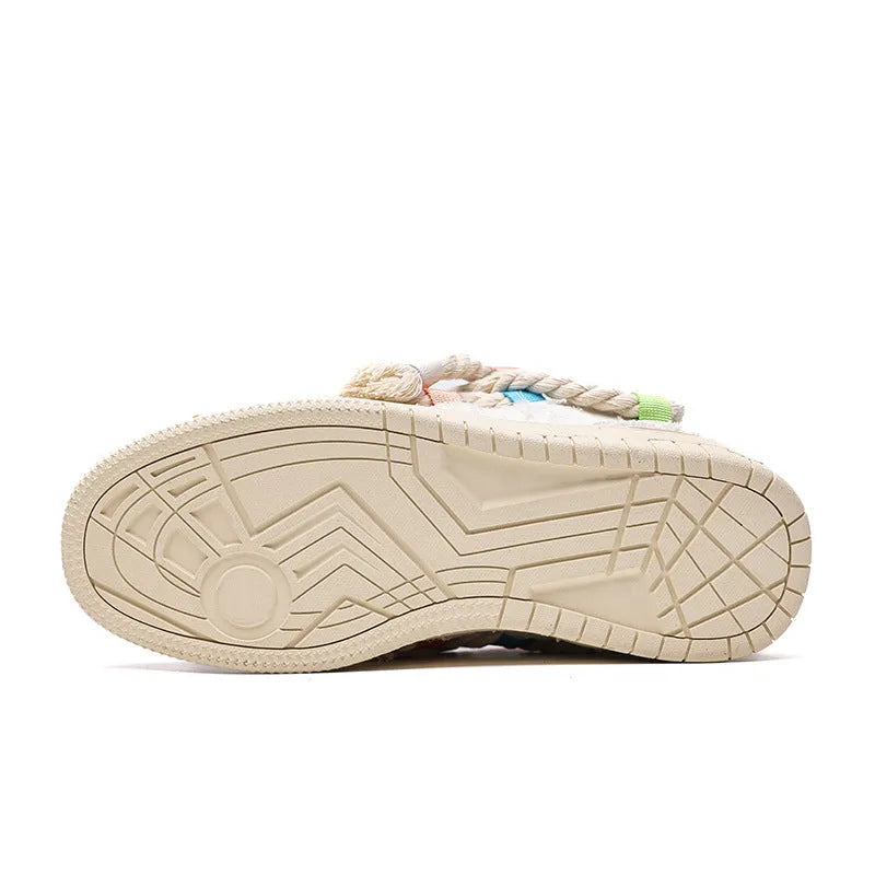 Creamy white old damage lace-up retro skateboard shoes with platform heel on a rubber sole.