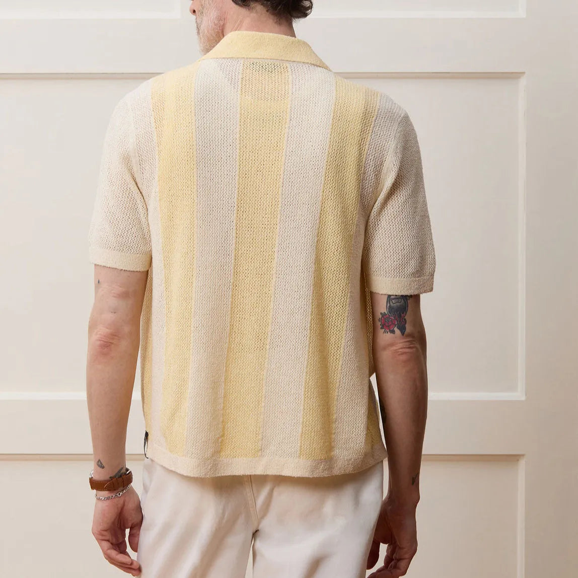 Yellow men's casual polo shirt with a hollow-out asymmetric design on the front.