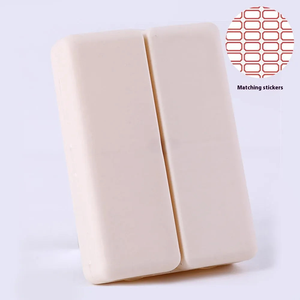 Blue foldable pill box with seven compartments and magnetic closure showing open and closed positions