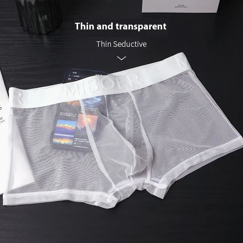 Men's thin flat-knit boxer shorts in black, showing the minimalist design and soft texture of the quick-dry fabric.