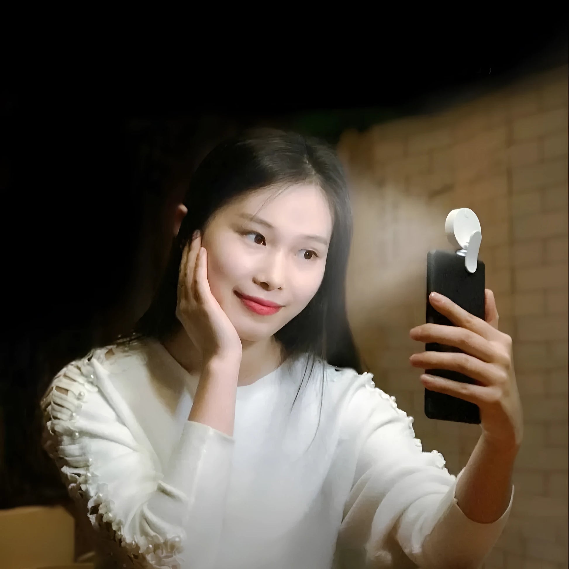 Compact white selfie fill light for mobile phones with USB cable, showing 9 LED beads and three-level dimming switch.