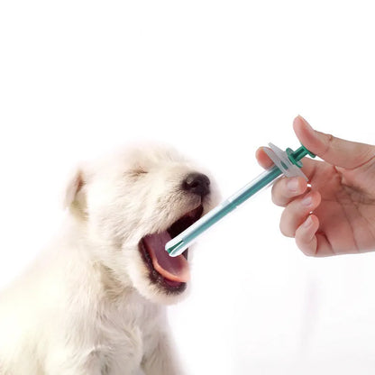 Two silicone-tipped pet pill shooter syringes for cat and dog medicine.
