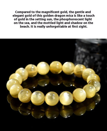 Yellow golden dragon mica round beads bracelet with polished geometric beads on a string.