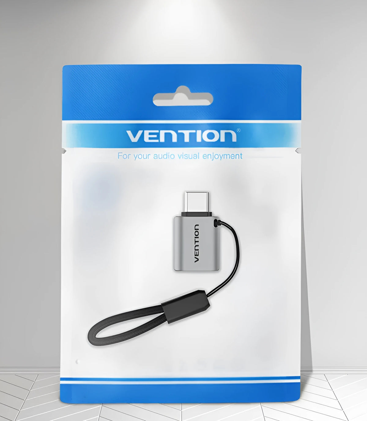 Grey aluminium alloy USB-C male to USB-A female OTG adapter with lanyard hole.