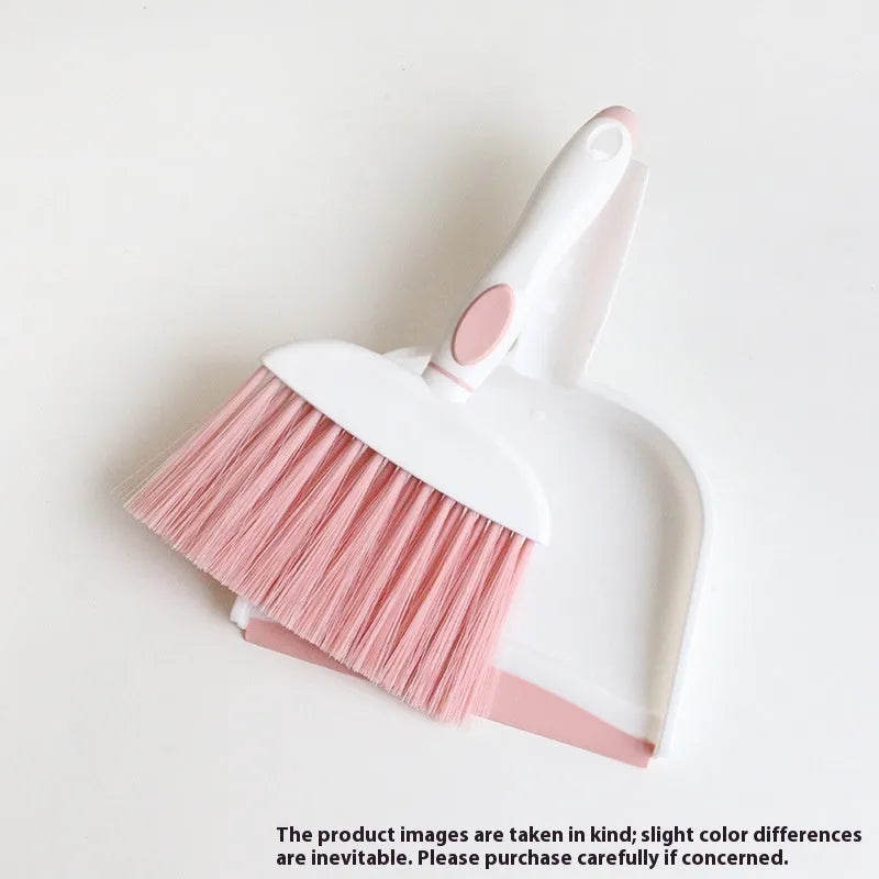 Small plastic handheld dustpan and brush cleaning kit in assorted colours.