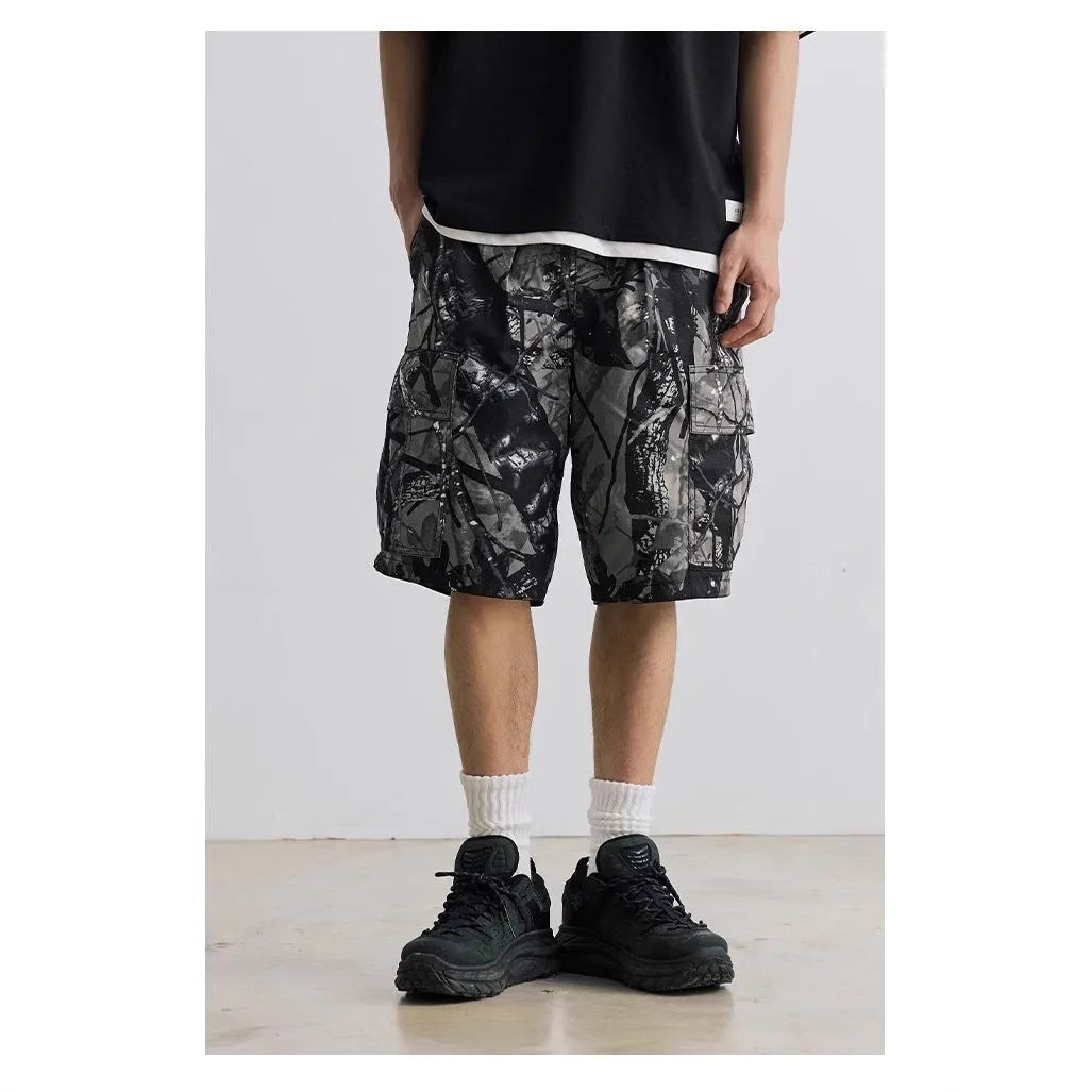 Women's loose fit denim shorts in army green colour, showing straight-leg cut and zip placket.
