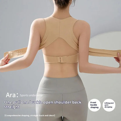 Front buckle closure on a black women's yoga bra with fixed double shoulder straps and a 3/4 cup.