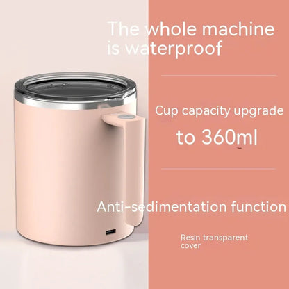 White automatic stirring coffee cup with magnetic base on a wooden table, showing simple solid-colour design.