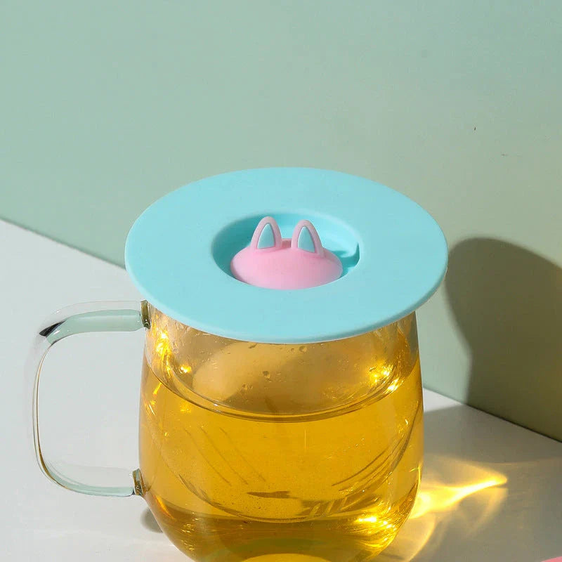 Charming cat ear silicone sealing lid in vibrant colours, designed to keep drinks fresh and prevent spills
