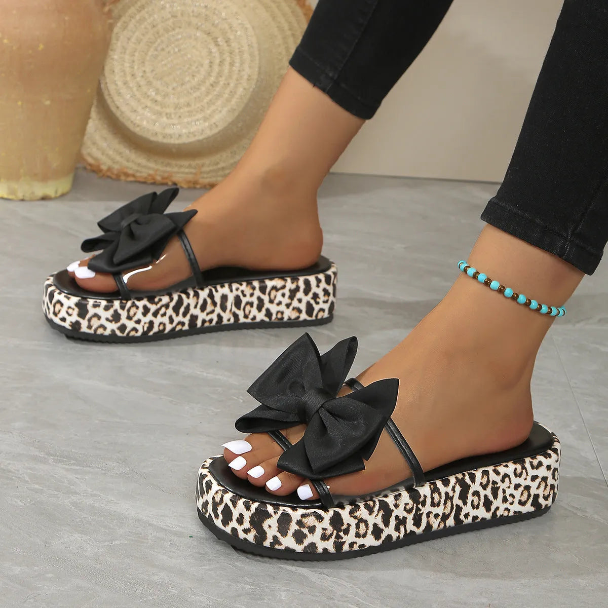 Women's leopard print thick sole beach slippers with round toe and PU upper in black and white options