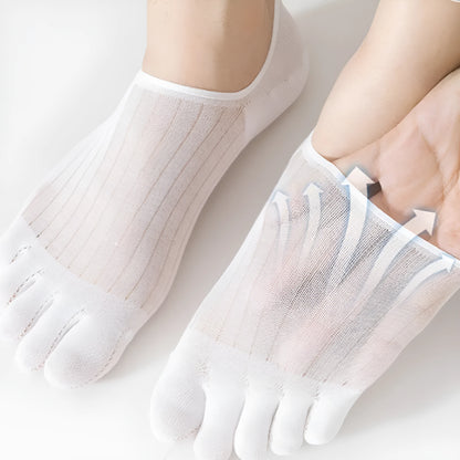 Pair of solid colour modal five-finger invisible socks on a wooden surface, showing toe separation and low-cut design.