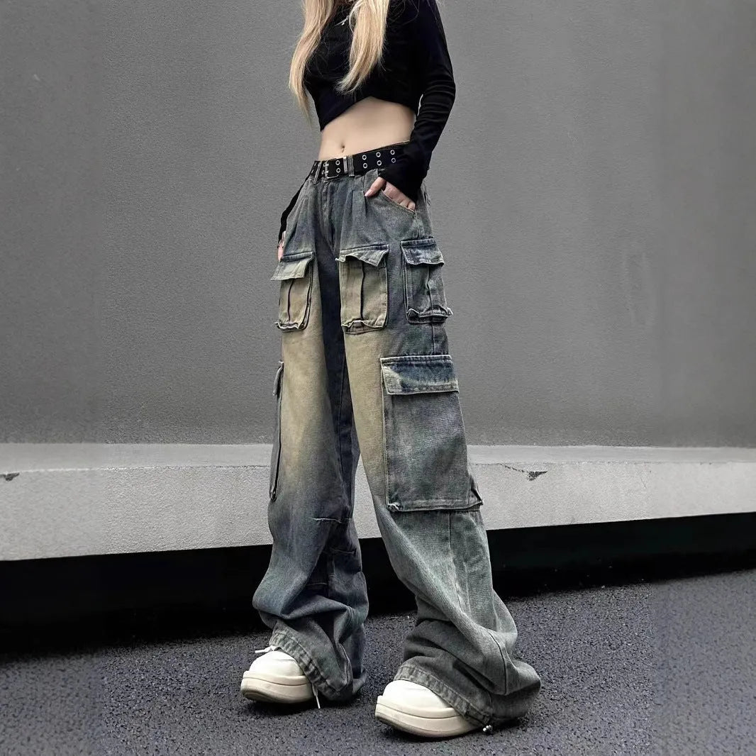 Men's loose straight-leg distressed jeans with multiple tooling pockets in light blue denim