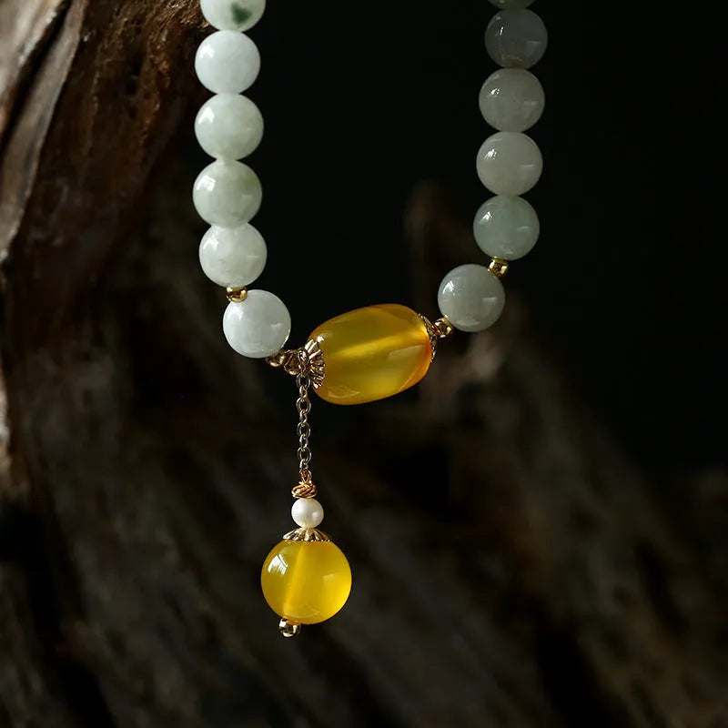 Geometric women's bracelet with hanging agate tassel and 14K gilded elements