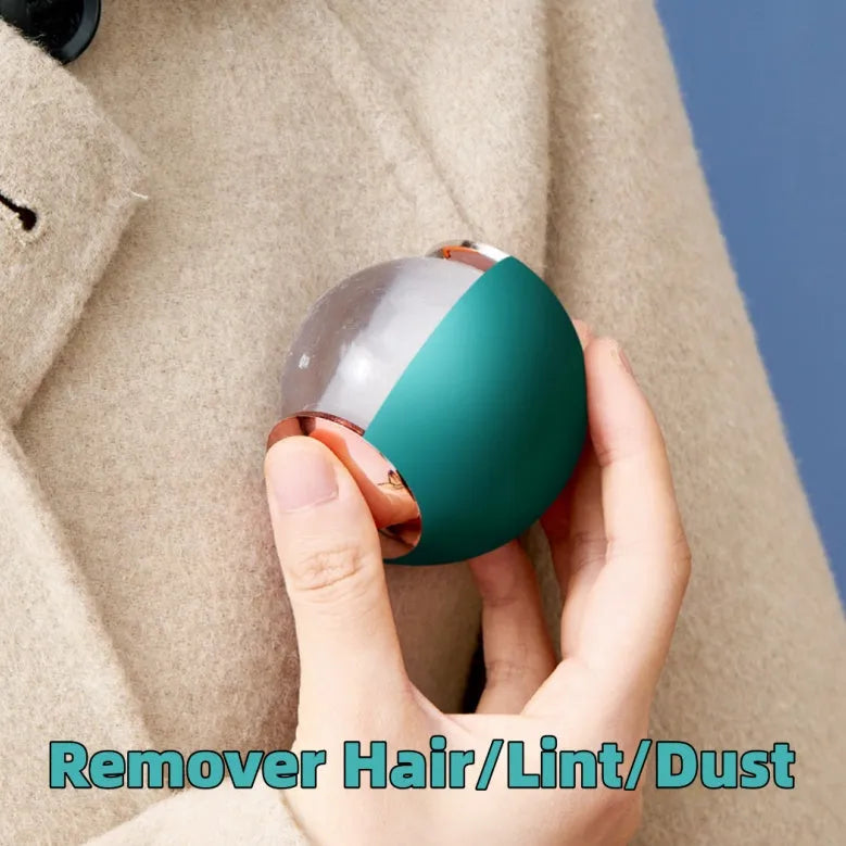 Reusable gel lint roller ball in green gold colour for removing pet hair and lint from fabrics.