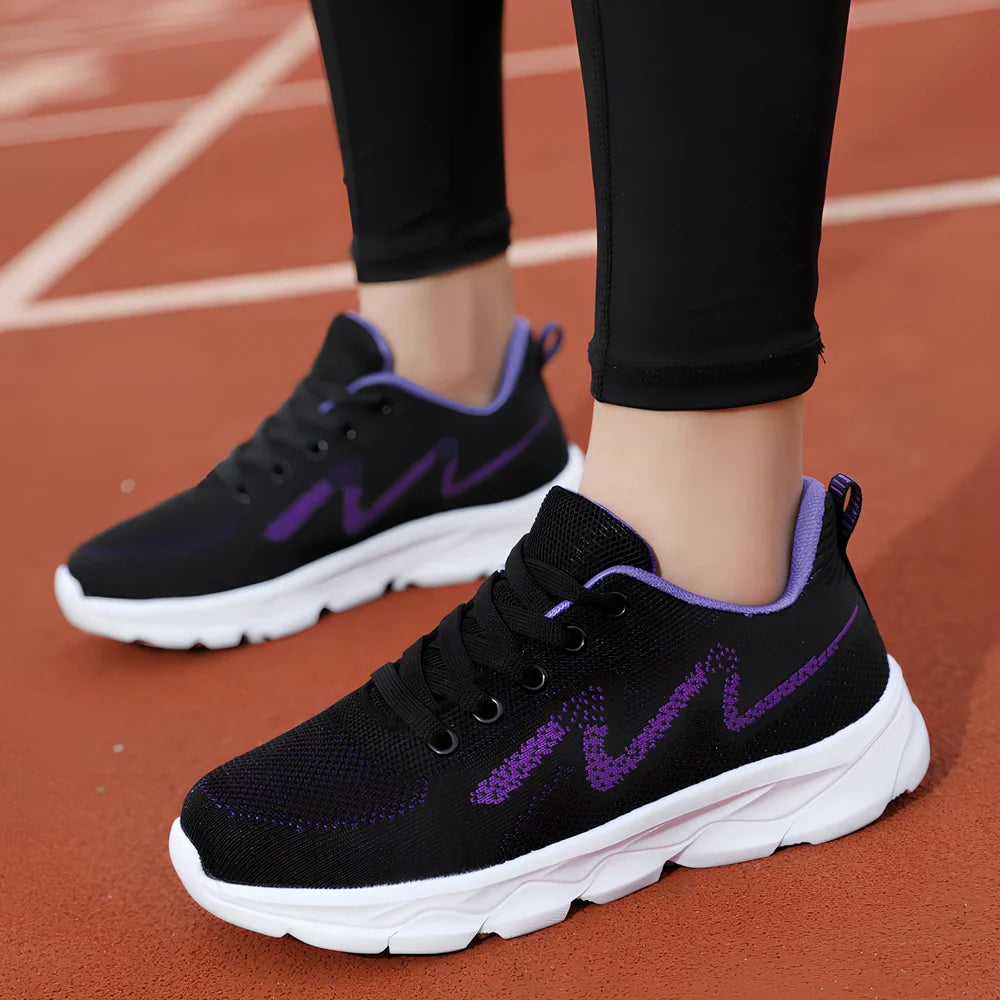Women's black mesh running shoes with cross-strap and 3-5cm wedge heel, fabric upper with sewing details