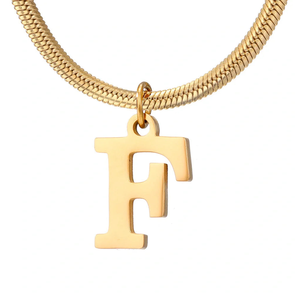 Elegant gold A-Z letter pendant necklace on a snake chain