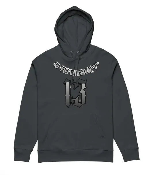 A person wearing a loose-fit, fleece-lined hooded sweater in a neutral colour, suitable for team uniforms or casual wear.