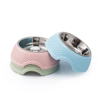 Set of four stainless steel pet bowls with non-slip bases in blue, green, and pink colours.