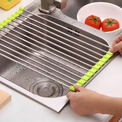 Stainless steel sink drain rack with rolling curtain design folded to show compact 5cm storage thickness