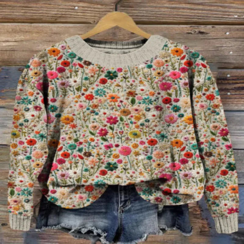 Women's round neck sweater with a colourful digital floral print on polyester fabric.