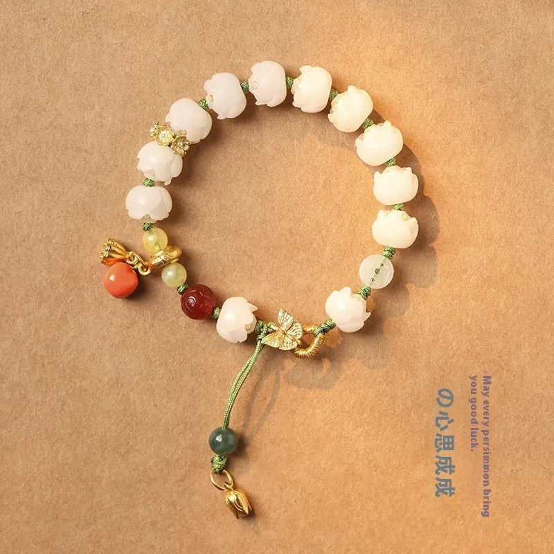 White jade Bodhi bracelet with lotus and pumpkin beads on open rope design