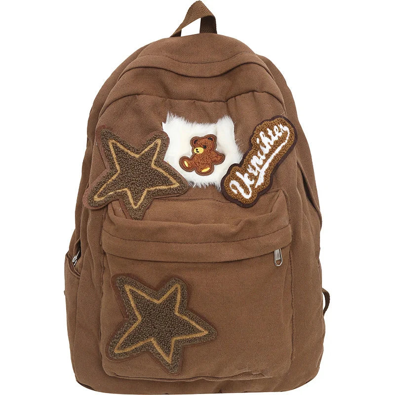 Brown canvas backpack with geometric patterns, ideal for female college students