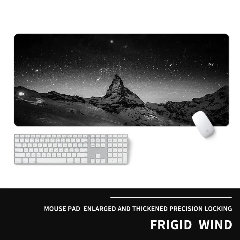Oversized rectangular mouse pad with a printed design on a desk, next to a keyboard and mouse.