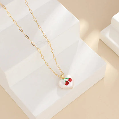 Geometric fruit heart pendant necklace on an adjustable chain, showing strawberry, pineapple, apple, pear, and cherry design options.