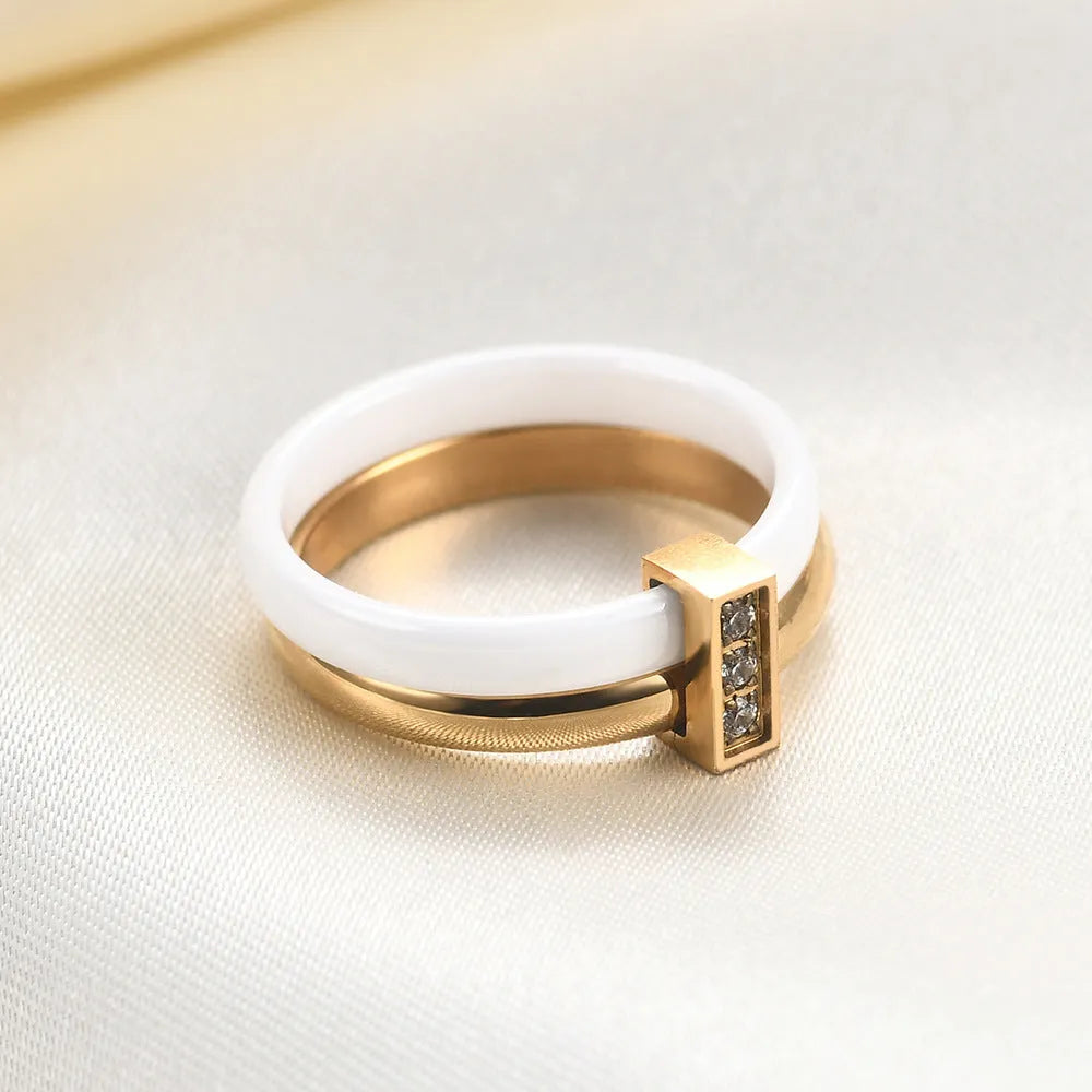 Women's ceramic ring with geometric design, glossy stitching, and zirconium inlay in steel black or gold white finish