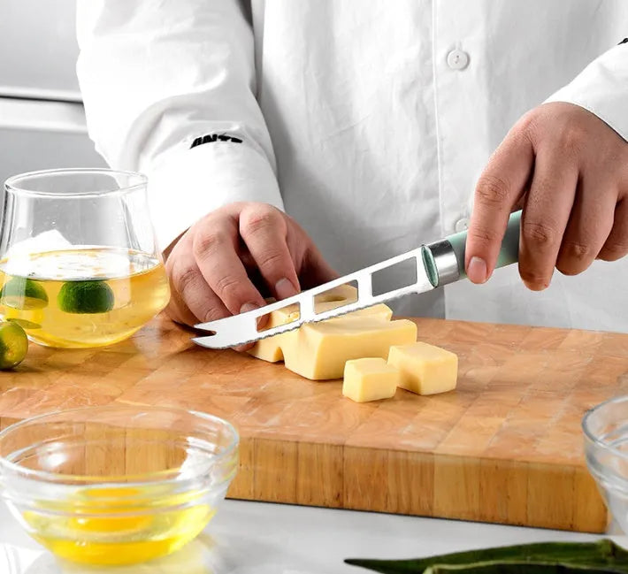 Nine-piece kitchen utensil set with stainless steel heads and plastic handles in four colour variations
