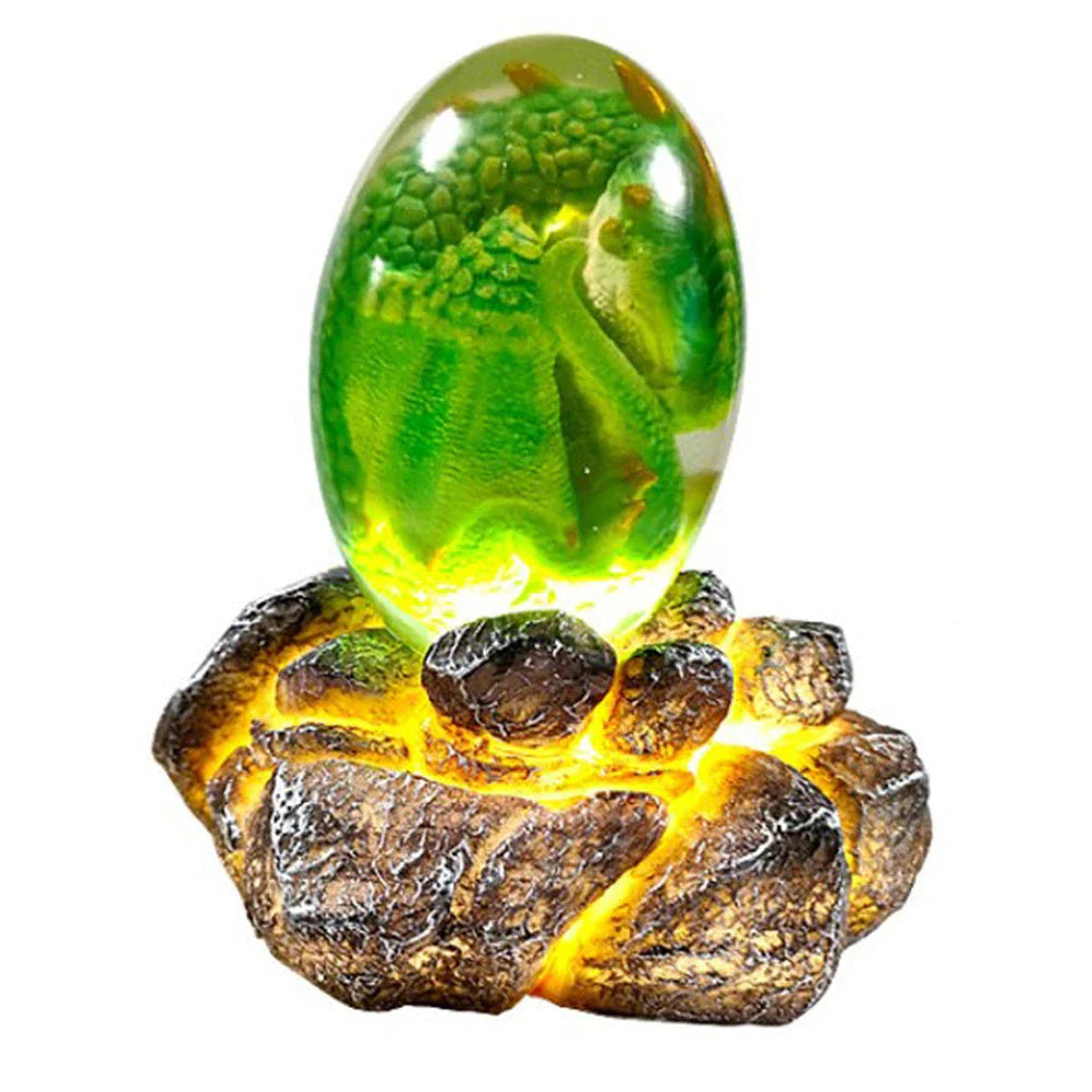 A lifelike resin dragon egg ornament with a crystal-clear, transparent design, sitting on a glowing lava-style base.