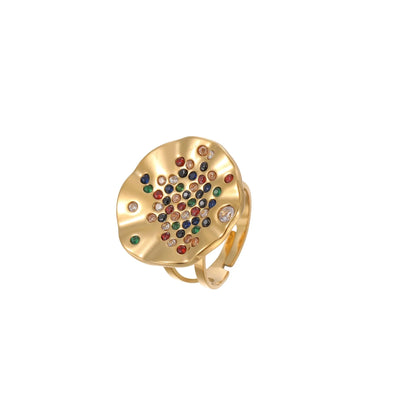Geometric open-mouth stainless steel ring with pleated inlaid colour diamonds on a white background.
