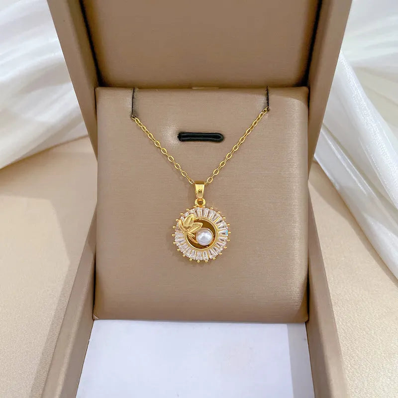 Women's geometric leaves design jewellery set with titanium steel necklace and gold plated stud earrings.