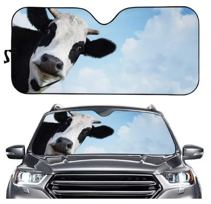 Telescopic aluminium foil car sun shield extended on a front car windshield.