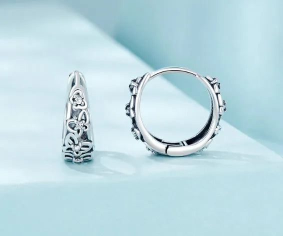 Sterling silver hollow butterfly earrings with zircon accents, retro design measuring 14mm by 5mm