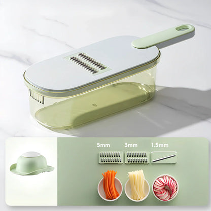 Shredded vegetable slicer with stainless steel blades on green cutting board