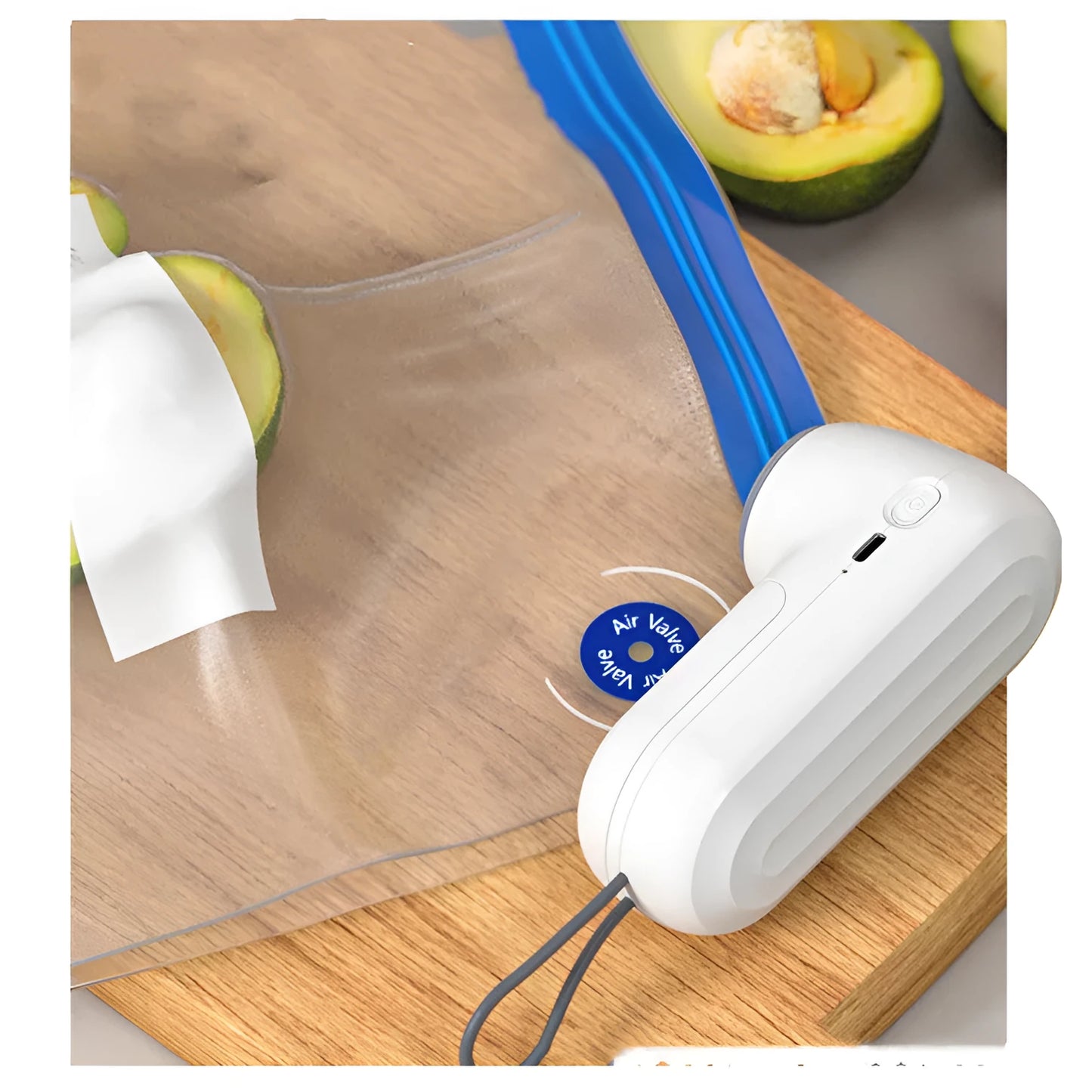 White handheld vacuum sealing machine with USB charging port on a kitchen counter.